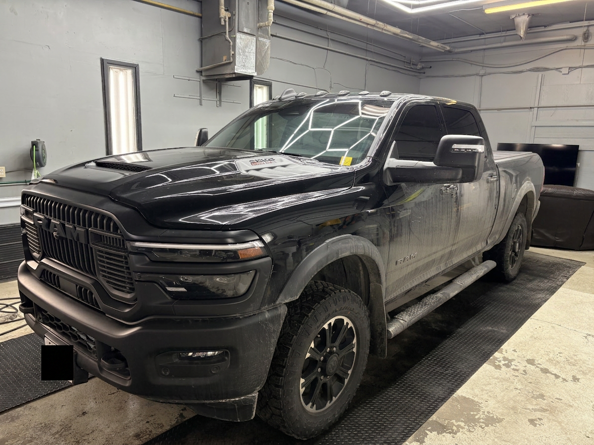 Ram 2500 front three-quarter, dusty before detail